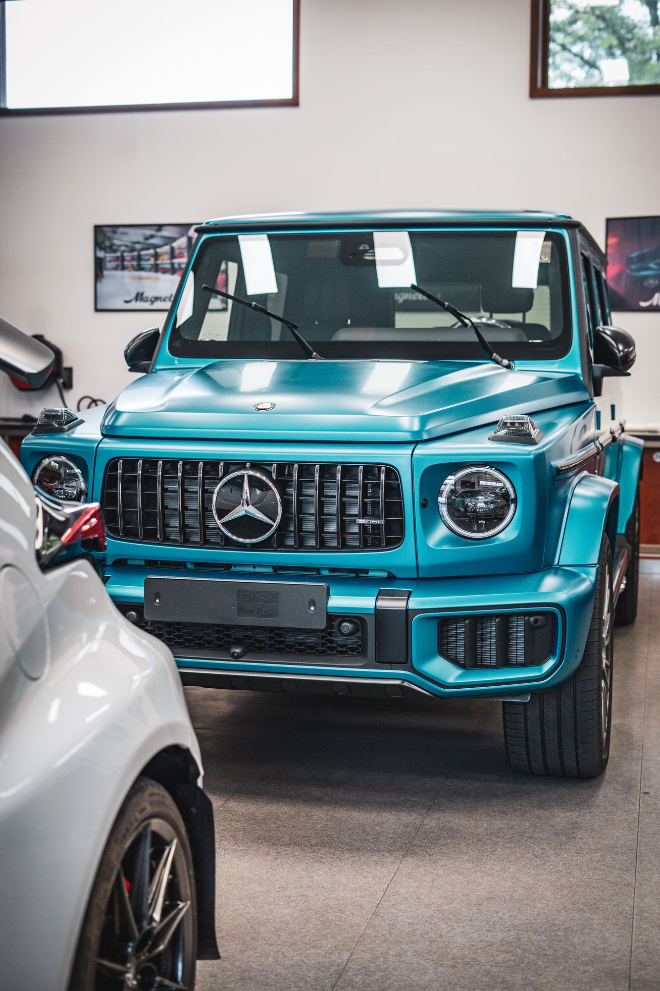 Mercedes-AMG G v tyrkysovém matu po dokončení péče